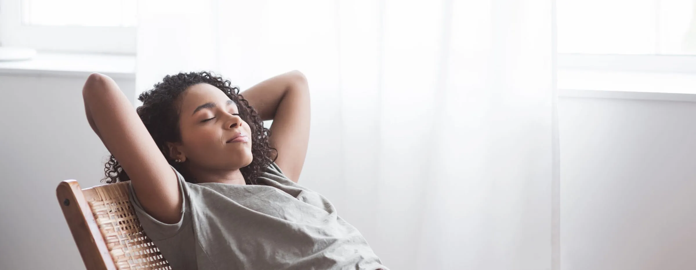 A relaxed woman resting peacefully with her eyes closed
