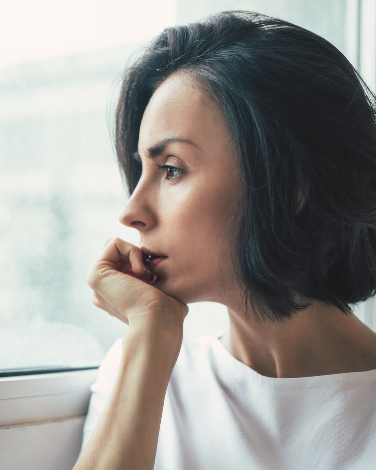 A woman looking out of a window
